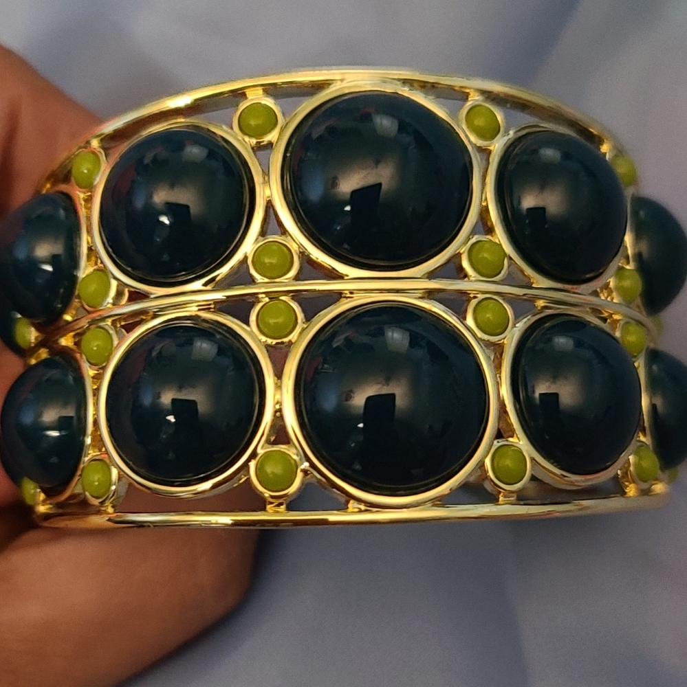 Jewelmint gold bangle with green stones